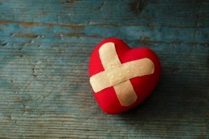 Heart with a bandaid cross